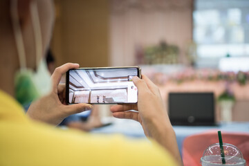 Teacher male using application on mobile phones taking photo and posts on social media in conference room, Sharing reunion enjoying. soft focus