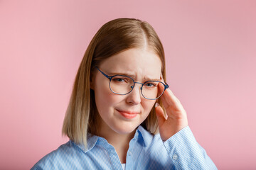 Woman is suffering from stress headache. Sad upset Emotional portrait young teenager girl in...
