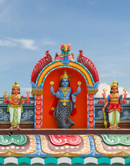 Matsya avatar of Vishnu statue on temple tower	
