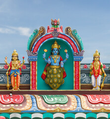 Kurma avatar of Vishnu statue on temple tower	