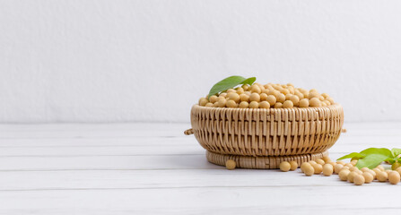 Soybean or soya bean in a bowl on white table background, healthy concept.