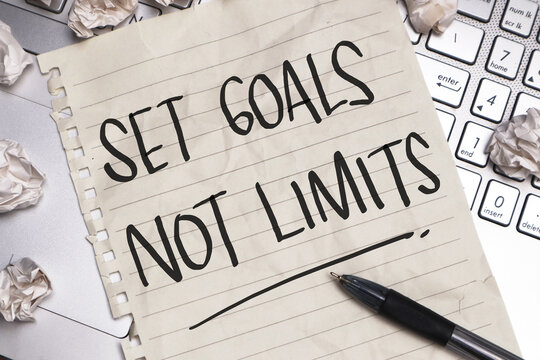 Set Goals Not Limits, text words typography written on paper, life and business motivational inspirational