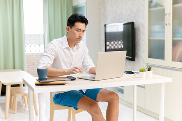 Asian man work at home