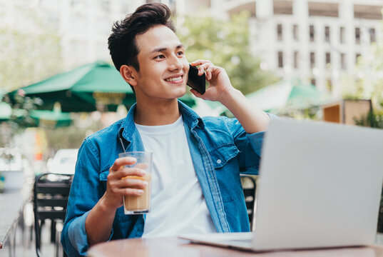 Young Asian man working at coffee shop
