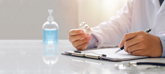 The male doctor checks the vaccine concept of a doctor to conduct research.