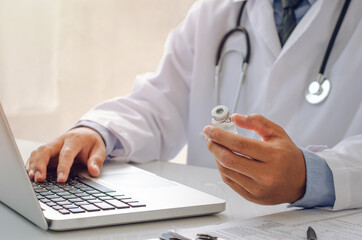 The male doctor checks the vaccine concept of a doctor to conduct research.