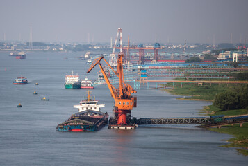 Jiujiang, China - May 9, 2021: A view of the Yangtze River in the middle and lower reaches of China is full of cargo ships. Chinese shipping has recovered to the level before the COVID-19 outbreak.