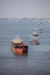 Jiujiang, China - May 9, 2021: A view of the Yangtze River in the middle and lower reaches of China is full of cargo ships. Chinese shipping has recovered to the level before the COVID-19 outbreak.