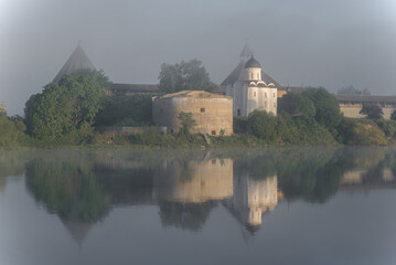 Fototapeta na wymiar Foggy June morning at the ancient Old Ladoga fortress. Leningrad region, Russia