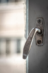 Closed a large white wooden old window close-up.
