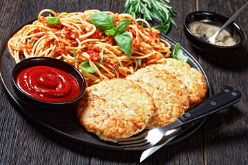 cod fish patties with pasta, top view