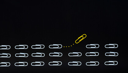 Different thinking concept. yellow paper clip leaving the group. New ideas creativity and different...