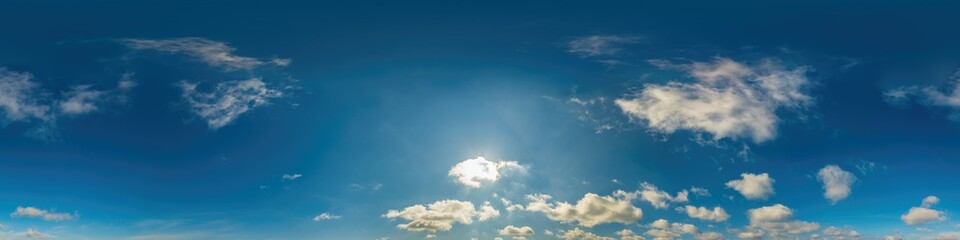 Blue sky panorama with Cirrus clouds in Seamless spherical equirectangular format. Full zenith for use in 3D graphics, game and editing aerial drone 360 degree panoramas for sky replacement.