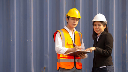 Boss woman and worker checking products results on the tablet at logistic and Explain for understanding about products.