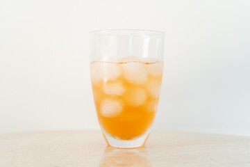 Orange lemonade with ice close up