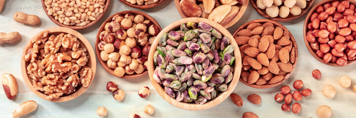 Nut panorama. Various nuts, shot from the top on a rustic background