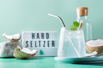 Tropical hard seltzer cocktail with coconut water and ice - obrazy, fototapety, plakaty