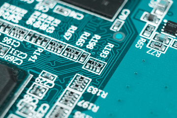 Macro shot of Circuit board with resistors microchips and electronic components. Computer hardware...
