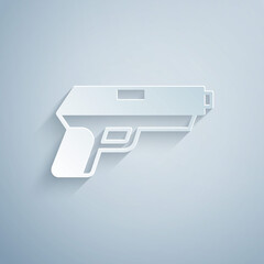 Paper cut Pistol or gun icon isolated on grey background. Police or military handgun. Small firearm. Paper art style. Vector