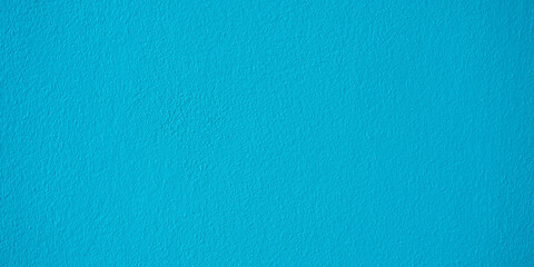 Blue cement or concrete wall texture for background. Wide image.