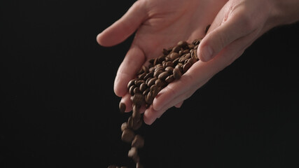 mam pour coffee beans over balck background