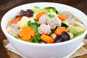 Homemade soup with pork and tofu, egg, lettuce, celery  (Kang Jued Tao Hoo)