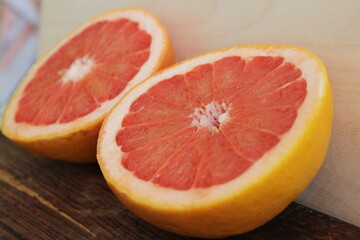 Naklejka na ściany i meble grapefruit on the table, juicy and beautiful grapefruit