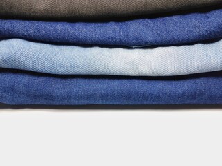 Blue jeans Are neatly folded into layers And white space is copied Use them as backgrounds and...