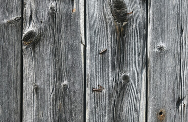 Close up picture of an old rough wooden board wall.