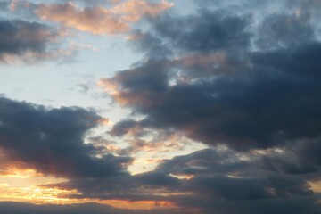 Naklejka na ściany i meble Beautiful sunset with dark clouds