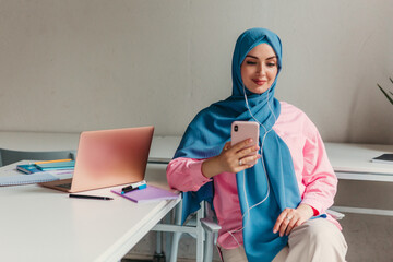 Fototapeta na wymiar muslim woman in hijab working in office room