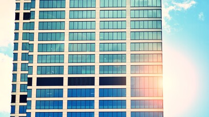 Modern building in the city with sunlight. Abstract texture and blue glass facade in modern office building., Retro stylized colorful tonal filter effect.