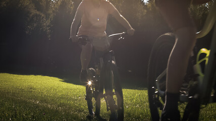 Two girls on mtb bikes. Mother and daughter riding on a forest trail.