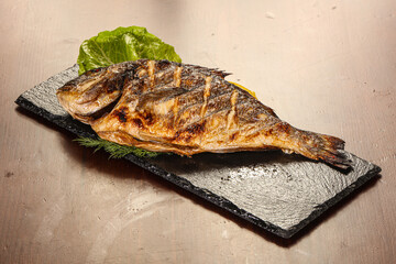 Grilled dorada servel lemon slice
