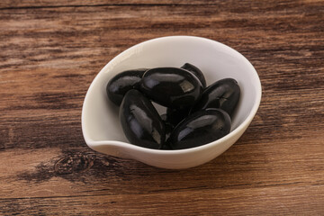 Pickled black olives in the bowl