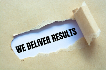 Text sign showing WE DELIVER RESULTS
