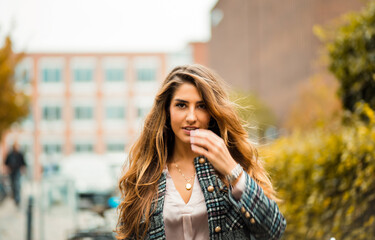 Woman on street. Focus is on woman.  Beautiful woman.