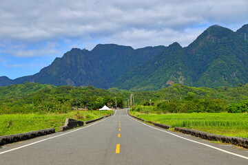 Fototapeta premium King Kong Avenue (King Kong Boulevard, Diamond Avenue, Tadao bike trails) route surrounded by mountains, terraced fields and the sea located at Taitung, eastern Taiwan