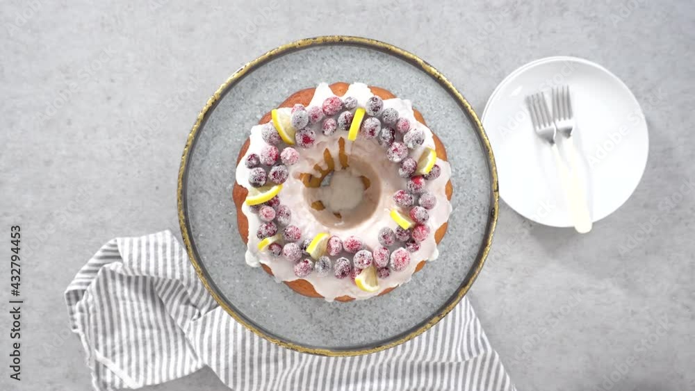 Poster flat lay. step by step. slicing lemon cranberry bundt cake decorated with sugar cranberries and lemo