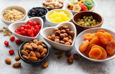 Bowls with various dried fruits and nuts