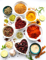 Various spices in a bowls  on white  background. Top view copy space.