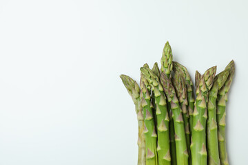 Fresh green asparagus on white background, space for text
