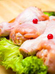raw chicken legs with spices