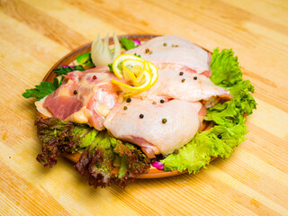 raw chicken breasts with spices