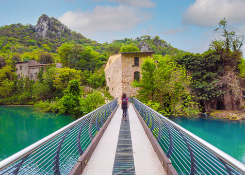 Gole del Nera (Narni, Italy) - The old railway transformed in a cycle path, with the evocative landmarks of the medieval village of Stifone and the crystalline water of Mole; Umbria region.