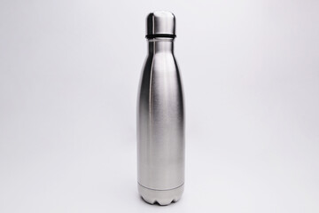 Stainless thermos water bottle, isolated on white background. Silver color. Blank stainless steel double wall workout bottle. empty stainless thermo water bottle close-up isolated on white background.