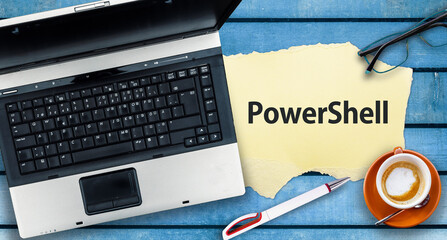 PowerShell Programming Language.  Word PowerShell on paper and laptop 