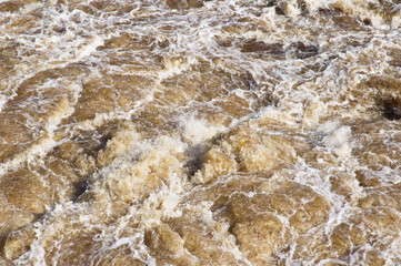 Close-up of turbulent river water, torrent rapids.
