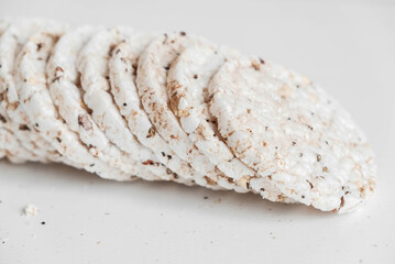 Round diet crispbreads on a white background. Round shaped cereal bread, healthy food without yeast. Copy, empty space for text