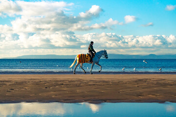Riding on the beach